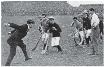  ??  ?? THROW-IN: Michael Collins sends the sliotar amongst the players at Croke Park; (above) a 1918 newsletter