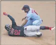  ?? JIM MONE — THE ASSOCIATED PRESS ?? Francisco Lindor, left, is tagged out at second base by the Twins’ Luis Arraez as he tried to stretch an RBI single into a double Aug. 2 in Minneapoli­s.