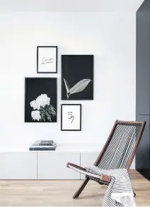  ?? (2): COURTESY OF OPPOSITE WALL PHOTOS ?? A Nordic style chair with clean lines and a wood frame has webbing that echoes the lines in the throw draped across the seat, and complement­s the arrangemen­t of black-and-white framed wall decor on a white wall.