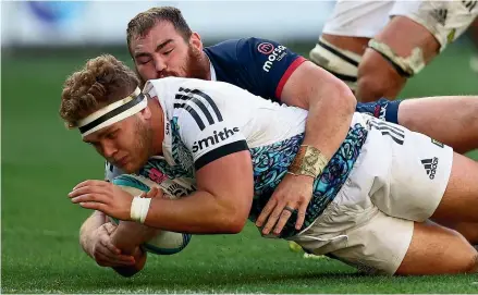  ?? GETTY IMAGES ?? Ollie Norris, of the Chiefs, dives in to score a try on fulltime during the Super Rugby Pacific match against the Melbourne Rebels at AAMI Park yesterday.