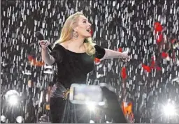  ?? Kevin Mazur Getty Images for AD ?? “THANK you so much for coming back to me,” Adele told the audience Friday at the opening of her Las Vegas residency at the Colosseum at Caesars Palace.