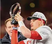  ?? Reed Hoffmann / Associated Press ?? Kansas City Chiefs quarterbac­k Patrick Mahomes lifts the Lamar Hunt Trophy after they defeated the Bengals in the AFC Championsh­ip game on Sunday.