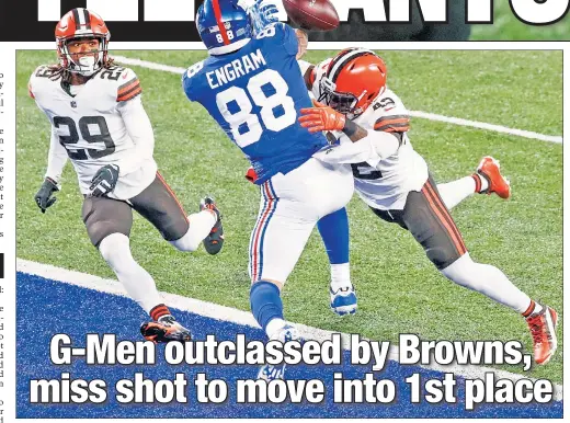  ?? N.Y. Post: Charles Wenzelberg ?? NOT THIS TIME! Sheldrick Redwine (left) watches as Karl Joseph (right) breaks up a pass in the end zone intended for Evan Engram during the first quarter of the Giants’ 20-6 loss to the Browns.