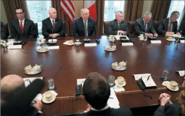  ?? PABLO MARTINEZ MONSIVAIS — THE ASSOCIATED PRESS ?? President Donald Trump and French President Emmanuel Macron during their meeting in the Cabinet Room of the White House in Washington, Tuesday.