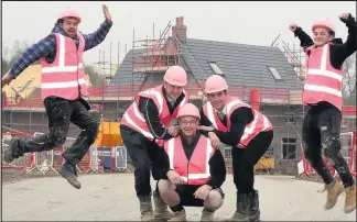  ??  ?? Constructi­on workers and sales team members from David Wilson Homes housing developmen­ts across Leicesters­hire wore pink protective gear for the Wear it Pink campaign to boost charity Breast Cancer Now. Among the developmen­ts in the county is The...
