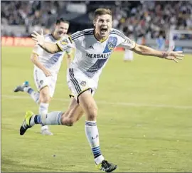  ?? Jae C. Hong Associated Press ?? STEVEN GERRARD celebrates his f irst goal as he makes his home debut for the Galaxy. He scored in the f irst half as the Galaxy utilized a different formation.