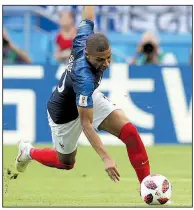  ?? AP/THANASSIS STAVRAKIS ?? Kylian Mbappe (above), 19, and 40-year-old teammate Thierry Henry lead France into today’s World Cup quarterfin­al match against Uruguay in Nizhny Novgorod, Russia.