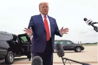  ?? ASSOCIATED PRESS ?? President Donald Trump talks to reporters as he arrives at Waukegan National Airport in Waukegan, Ill., on his way to visit Kenosha on Tuesday.