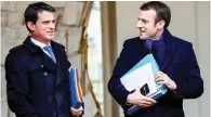  ?? - Reuters/Philippe Wojazer/Files ?? FIRST HIGH-PROFILE DEFECTION: Former French Prime Minister Manuel Valls, left, and Economy Minister Emmanuel Macron leave the Elysee palace in Paris, France. Valls said on May 9, 2017 that he wanted to stand for President-elect Emmanuel Macron’s...