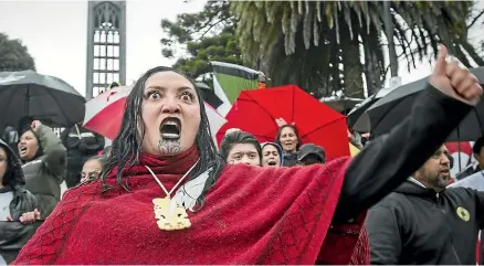  ?? VIRGINIA WOOLF/ STUFF ?? Estella Davis leads a haka to show solidarity for Ihuma¯tao occupiers, at the Nelson Church Steps at the top end of Trafalgar Street.