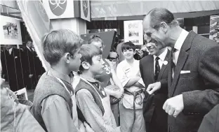  ??  ?? > Prince Philip on a visit to the Birmingham Lewis’s department store in 1970