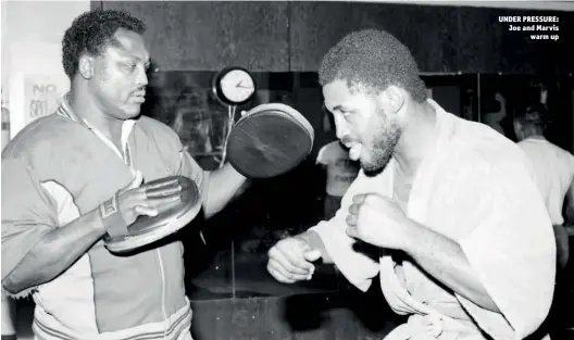  ?? Photo: GETTY IMAGES ?? UNDER PRESSURE: Joe and Marvis warm up