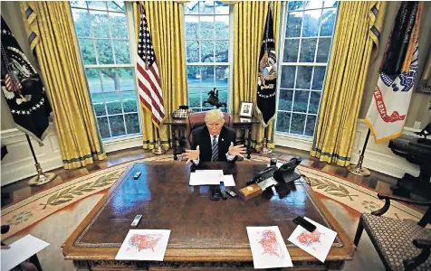  ??  ?? Donald Trump in the Oval Office. Mid-way through the interview to mark his 100-day milestone he handed out electoral maps of the US with the states he had won marked in red