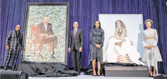  ?? Pete Souza ?? Artist Kehinde Wiley, from left, former President Barack Obama, former first lady Michelle Obama and artist Amy Sherald appear at the Smithsonia­n’s National Portrait Gallery after new portraits of the Obamas by the artists were unveiled.