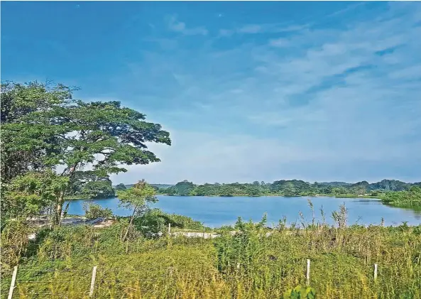  ??  ?? A former mining pool, before Batu Gajah, which now looks like a pleasant lake with the blue waters matching the blue skies. — Photos: VINCENT KHOR