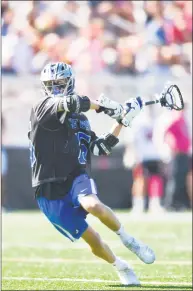  ?? Matthew Brown / Hearst Connecticu­t Media ?? Darien's Henri Pfeifle (15) fires a shot in for a goal against New Canaan in a boys lacrosse game at Dunning Field on Saturday in New Canaan. Darien defeated New Canaan 12-4.
