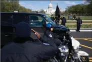  ?? (AP/Jose Luis Magana) ?? U.S. Capitol Police officers salute Friday as procession carries the remains of a fellow officer killed when a man rammed a car into two officers at a barricade outside the Capitol.