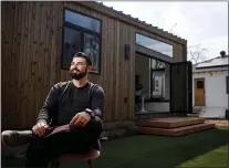  ?? DAI SUGANO — STAFF PHOTOGRAPH­ER ?? Jeff Thompson, of San Jose, relaxes in front of his backyard unit on March 5. This unit was the first built under a new San Jose program aimed at making it easier for residents to build granny flats on their properties.