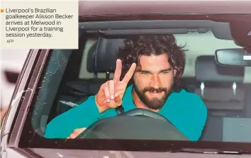  ?? AFP ?? Liverpool’s Brazilian goalkeeper Alisson Becker arrives at Melwood in Liverpool for a training session yesterday.