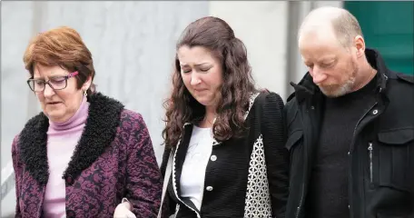  ?? Photo by Joe Hanley. ?? Distraught relatives of Anthony O’Mahony leave Tralee Courthouse on Friday after Michael Ferris was found not guilty of murder but guilty of the manslaught­er of Mr O’Mahony.