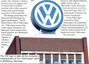  ??  ?? The VW logo is seen at the company’s headquarte­rs at the Volkswagen plant in Wolfsburg, Germany.