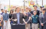  ?? ADOLPHE PIERRE-LOUIS/JOURNAL ?? Mayor Tim Keller is joined by a group of Central Avenue business owners on Thursday while announcing the end of major constructi­on on the Albuquerqu­e Rapid Transit project.