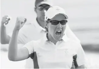  ?? ED ANDRIESKI/THE ASSOCIATE PRESS ?? Europe’s Carlota Ciganda from Spain, reacts after saving par on the 15th hole during four-ball matches at the Solheim Cup golf tournament Friday in Parker, Col.