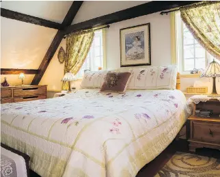  ??  ?? Country charm reigns in the huge master suite that occupies the width of the house.