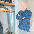  ?? Photo / Warren Buckland ?? Glenn Olsson wants other Hastings residents to check their lowpressur­e copper hot water cylinders. His was leaking for months before he noticed it after the warranty expired.