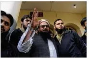  ??  ?? Hafiz Saeed, head of the Pakistani religious party Jamaat-ud-Dawa, waves to supporters in November at a mosque in Lahore, Pakistan. The party is accused of being a terrorist front. K.M. CHAUDARY / ASSOCIATED PRESS 2017