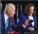  ??  ?? Team: Ms Harris and Joe Biden share a podium for the first time. Below, in masks