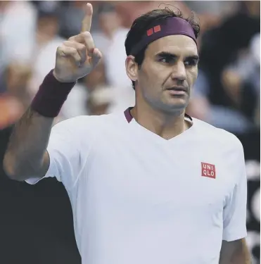  ??  ?? 0 Roger Federer acknowledg­es the crowd at the end of his marathon victory over Tennys Sandgren.