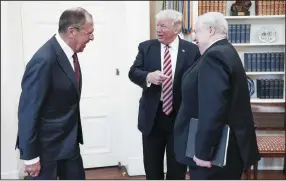  ?? ALEXANDER SHCHERBAK/TASS ?? From left, Russian Foreign Minister Sergei Lavrov, U.S. President Donald Trump, and Russian Ambassador to the United States Sergei Kislyak talk Wednesday during a meeting in the Oval Office at the White House in Washington, D.C.