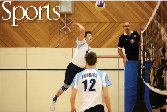  ?? CITIZEN PHOTO BY JAMES DOYLE ?? Nolan Minck of the College Heights Cougars goes high for a kill shot during the PGYVC Kodiak Classic high school volleyball tournament, held last Friday and Saturday. The Cougars defeated the D.P. Todd Trojans in the final at the College of New Caledonia.