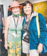  ??  ?? Sash Whitehead (left) and Noela Lowien admire some amazing indigenous artworks.