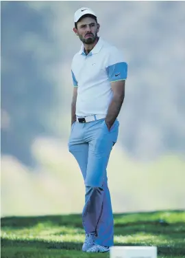  ?? Picture: AFP ?? PATIENT. A serious-looking Charl Schwartzel of South Africa waits to hit his tee shot on the 12th hole.