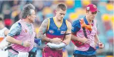  ?? Picture: GETTY IMAGES ?? Brisbane skipper Dayne Beams trudges off the field after suffering an injury against GWS last night