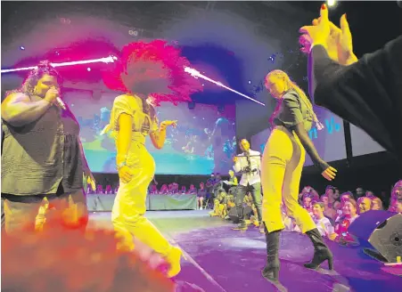  ?? MICHEL EULER, THE ASSOCIATED PRESS ?? Vogueing ballroom dancers perform on stage during a competitio­n in Paris. The 1980s dance movement Madonna popularize­d in her hit 1990 song of the same name, is experienci­ng a revival in France.