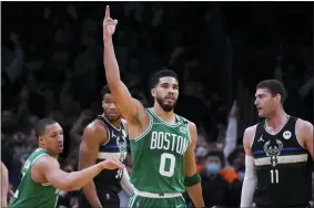  ?? CHARLES KRUPA — THE ASSOCIATED PRESS ?? The Celtics’ Jayson Tatum celebrates after a basket against the Bucks on May 3.