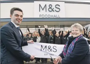  ?? Photograph­s Iain Ferguson, The Write Image. ?? Isabel Campbell of Lochaber Rural Education Trust cuts the ribbon to officially open the new M&S Foodhall in Fort William last Thursday, with store manager, Sam Nugent.