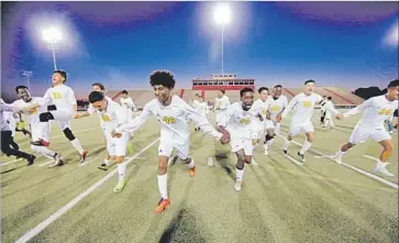  ?? Photograph­s by Gary Coronado Los Angeles Times ?? THE SOCCER TEAM at Margaret Long Wisdom High School in Houston celebrates an undefeated season in March. Members of the team hail from Central America, Mexico and Africa and speak several languages.