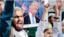  ?? PIC/PTI ?? Pakistani religious students protest against U.S. President Donald Trump in Lahore, Pakistan.