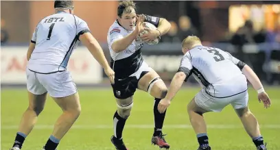  ??  ?? Rhys Shellard of Pontypridd takes on Corey Domachowsk­i of Cardiff and Kieron Assiratti of Cardiff