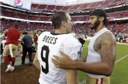  ?? Associated Press file ?? San Francisco’s Colin Kaepernick, right, is greeted by New Orleans’ Drew Brees in 2016. Brees drew sharp criticism this week after he reiterated his opposition to Kaepernick’s kneeling during the national anthem.