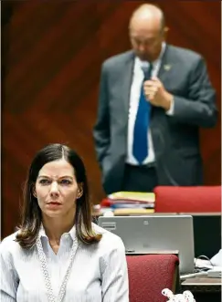  ?? — AP ?? Arizona state’s Rep. Michelle Ugenti-Rita (left) listens as Rep. Don Shooter reads a statement regarding sexual harassment and other misconduct complaints made against him by Ugenti-Rita and others.