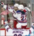  ?? RYAN REMIORZ — THE CANADIAN PRESS VIA AP ?? Rangers center Mika Zibanejad (93) celebrates with teammates Nick Holden (22) and Pavel Buchnevich (89) after scoring the game-winning goal during against the Canadiens during Game 5 Thursday in Montreal.