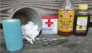  ??  ?? Keep your homemade first aid kit in an easy-to-find place.