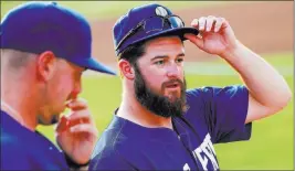  ?? Chase Stevens ?? Las Vegas Review-journal @csstevensp­hoto Reliever Bobby Wahl, right, on being dealt to the 51s: “You don’t really ever think it’s going to happen to you.”