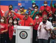  ?? (AP/Ariana Cubillos) ?? Venezuelan President Nicolas Maduro speaks to supporters Thursday in Caracas during a closing campaign rally for National Assembly elections. Venezuelan­s go to the polls Sunday.