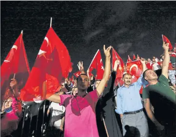  ??  ?? TENSION: A large crowd blocked access overnight to a Turkish military base amid nervousnes­s following a failed coup.